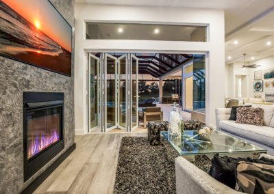 Living room next to glass sliding doors and fireplace