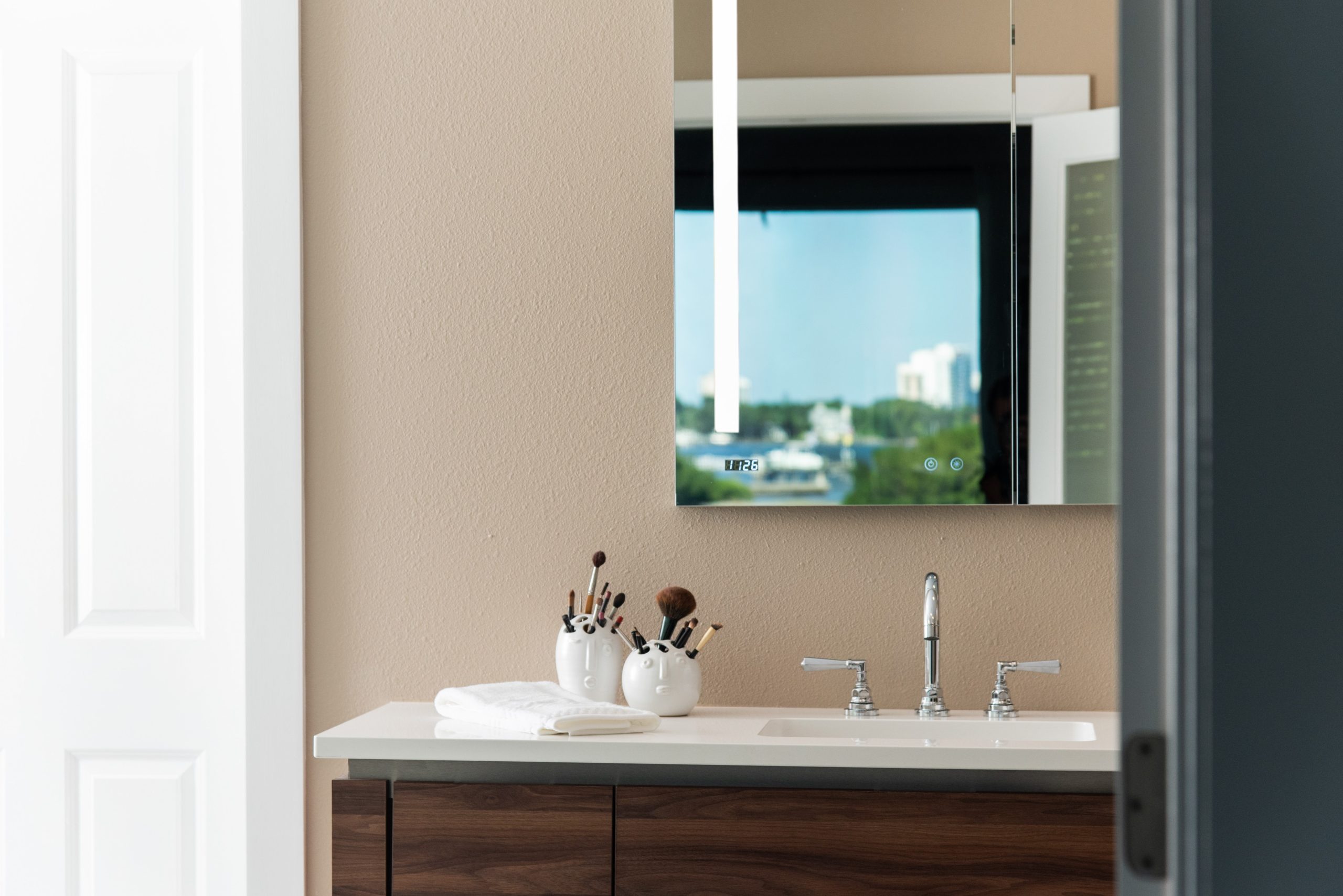 bathroom vanity with mirror of view of Sarasota Bay