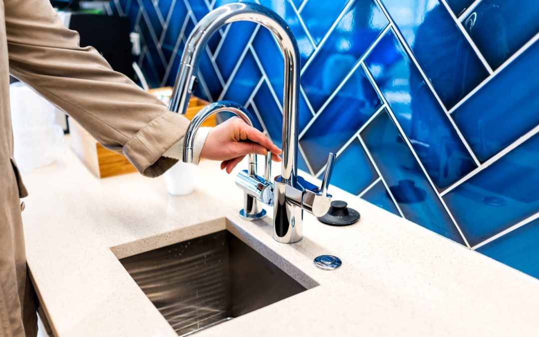 Blue tile backsplash and silver faucet