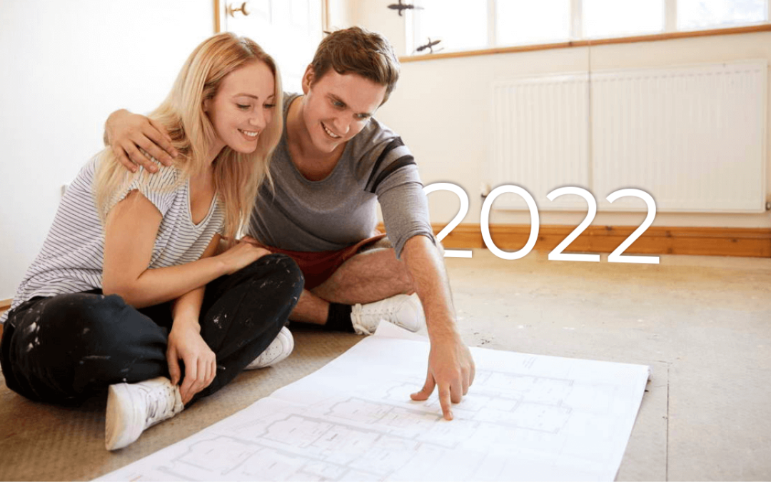 young couple looking at house plans