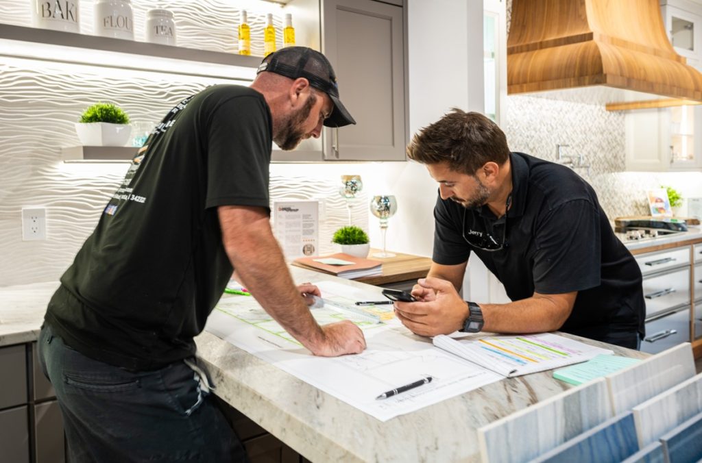 Two men looking over home plans