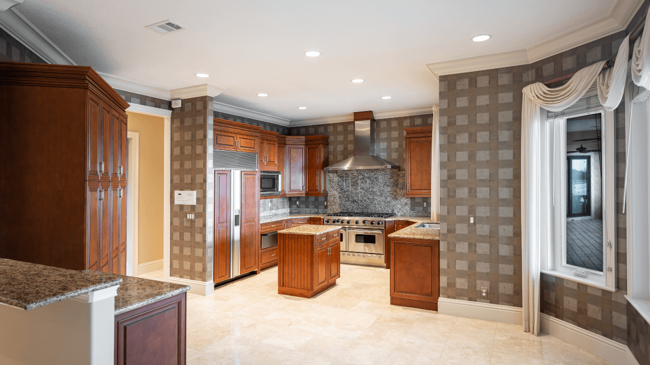 Kitchen with cherry cabinets and gray walllpaper